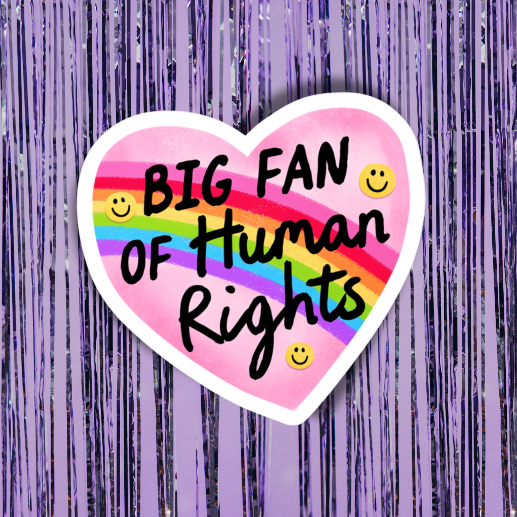 Heart-shaped sticker with rainbow text 'BIG FAN OF HUMAN RIGHTS' on a purple background