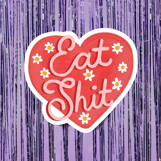 Heart-shaped sticker with 'Eat Shit' text on a purple background
