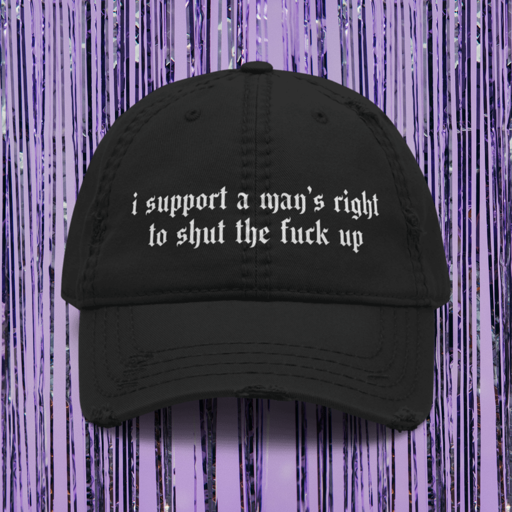 Black cap with text on a purple background