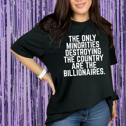 Person wearing a black t-shirt with a statement on it against a purple background